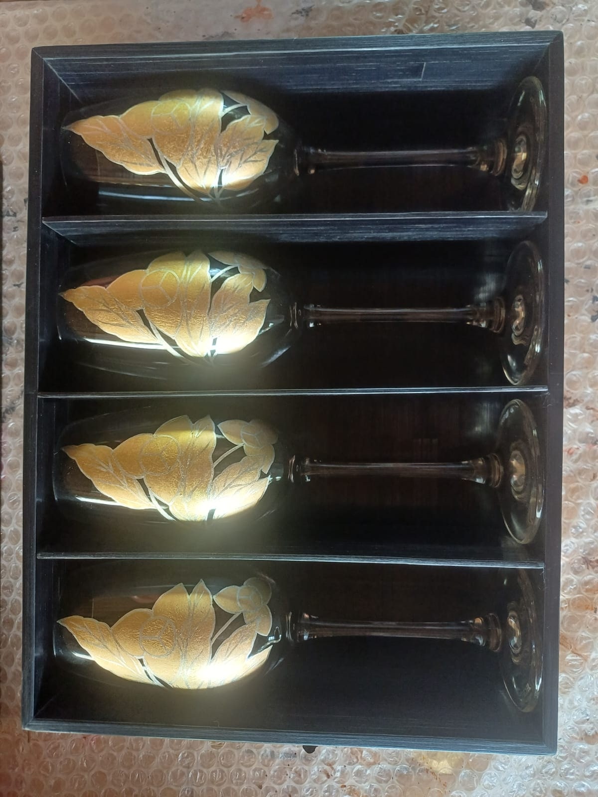 Bespoke set of four champagne flutes with hand-applied 24k gold leaf — Explorer's Tales commission by Stocker Studio