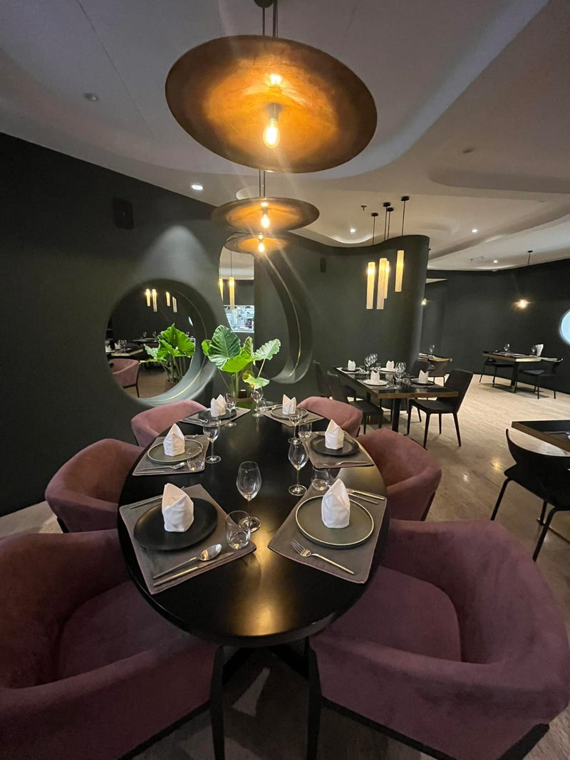 Lacquer pendant lights and dining décor by Stocker Studio in a Siem Reap restaurant interior