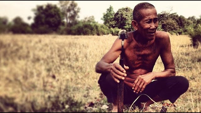 Cambodian lacquer tapper in field — still from Community First documentary on Stocker Studio