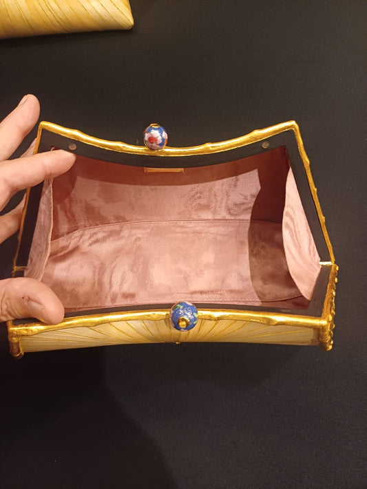 Stocker Studio Hourglass clutch — interior view with twin cloisonné enamel clasp and dusty-rose silk-velvet lining