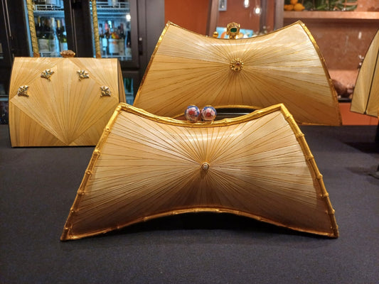 Stocker Studio Hourglass clutch with crown-jewel clasp — golden rye-straw marquetry