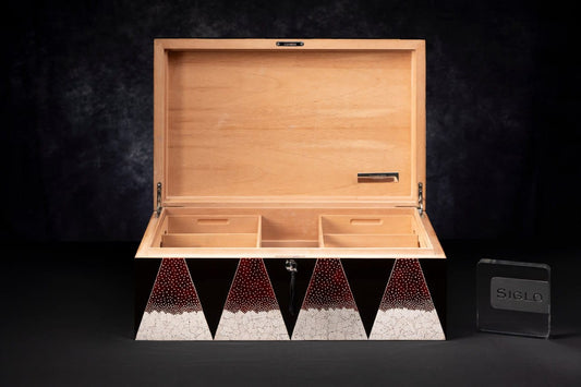 SIGLO × Eric Stocker DUNAND humidor — closed studio view, red eggshell mosaic and black-lacquer diamond pattern