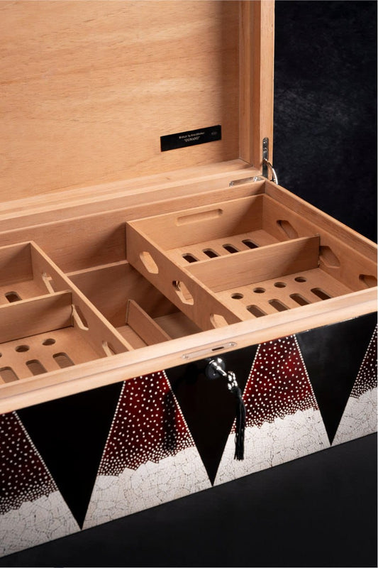SIGLO × Eric Stocker FRANK humidor — closed, natural rye-straw sunburst marquetry inspired by Jean-Michel Frank