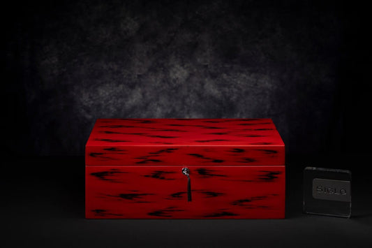 SIGLO × Eric Stocker NEGORO humidor — vermilion natural lacquer with revealed black-lacquer brushwork pattern