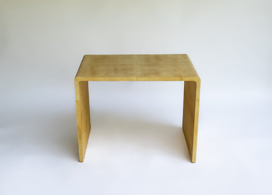 Stocker Studio compact waterfall side table finished in warm parchment-tone natural lacquer